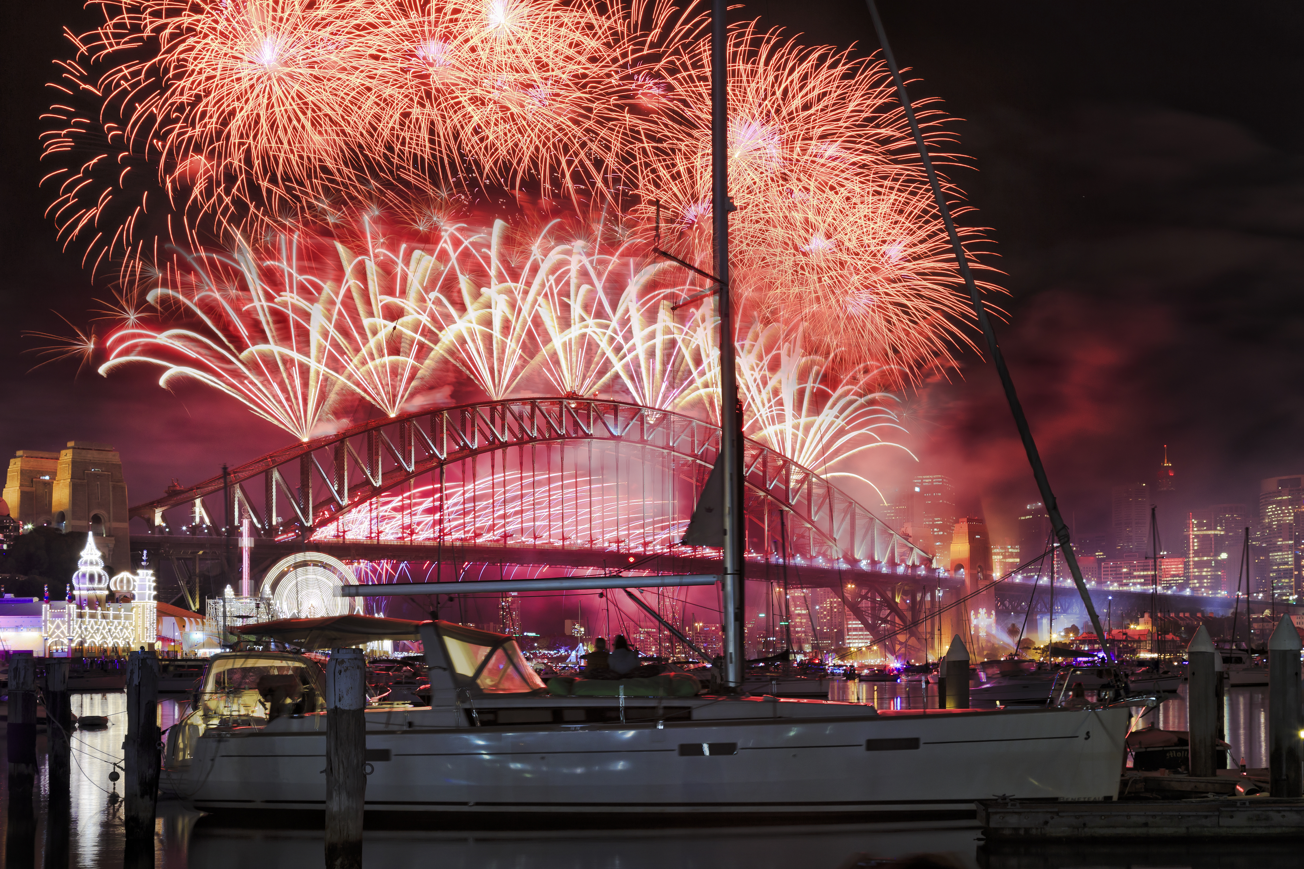 close up view of action at Sydney's New Year fireworks across Sydney Bridge and Harbour as viewed from Lavender bay