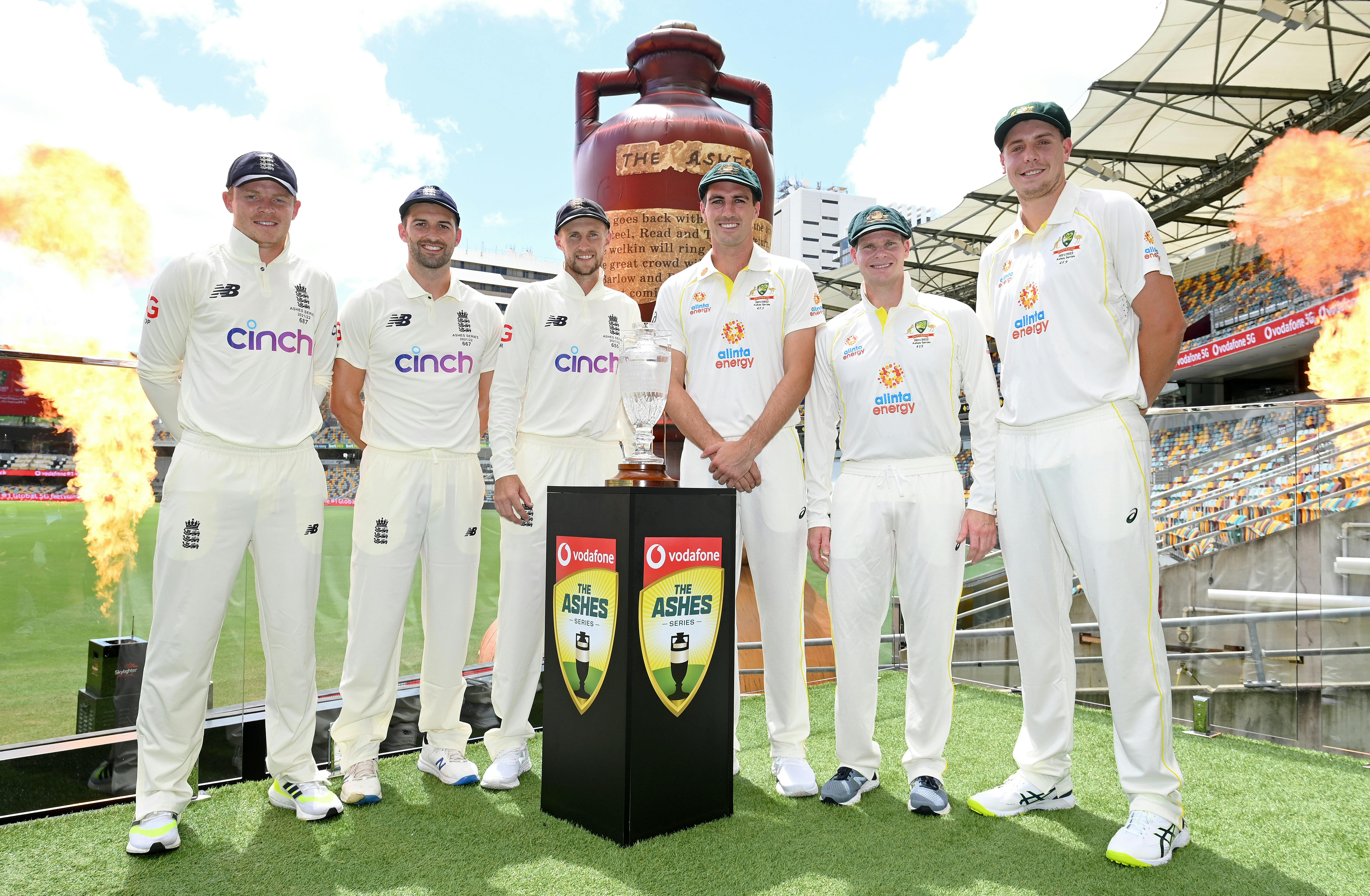 England and Australia pose in front of the Ashes Trophy